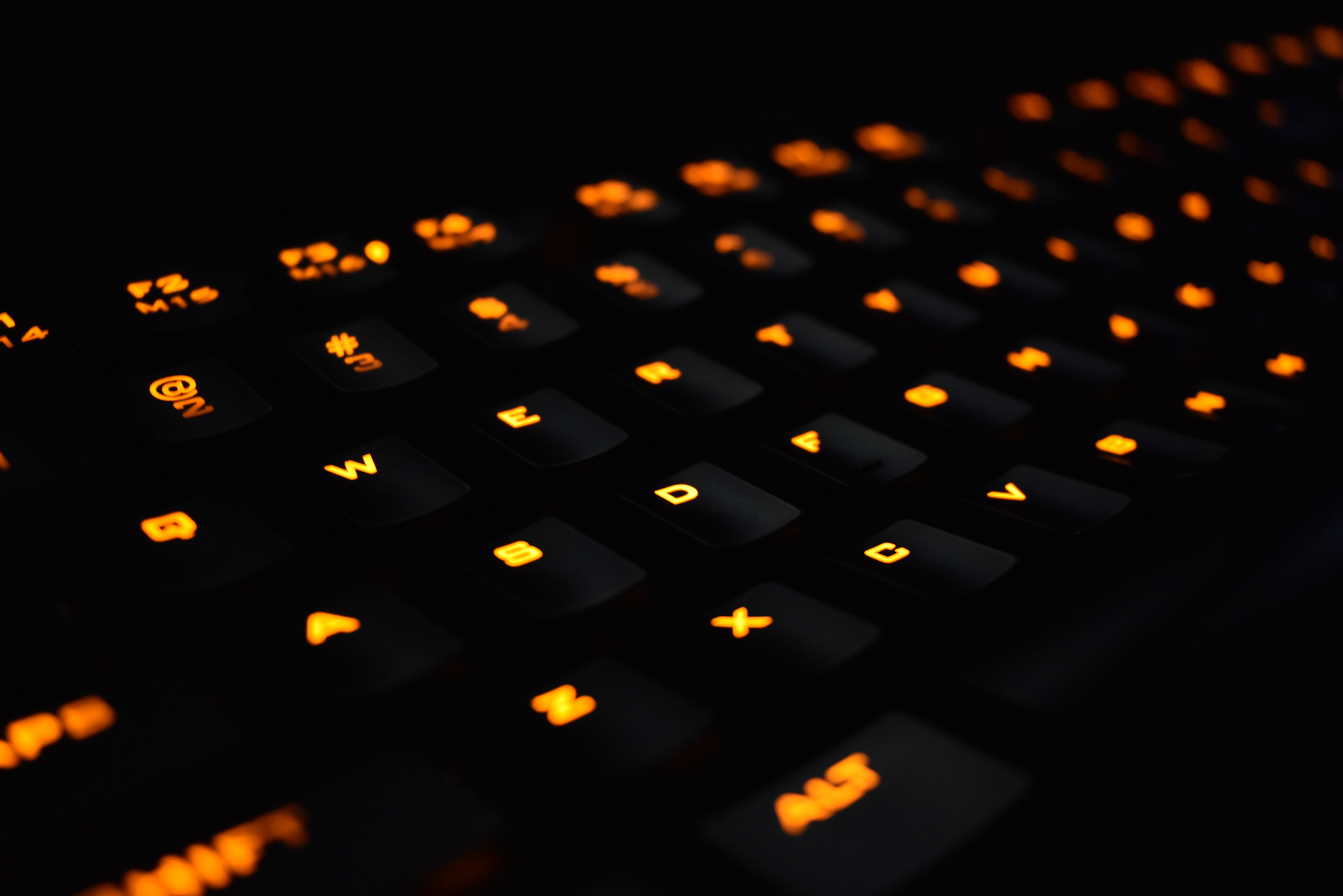 black keyboard with yellow illumination