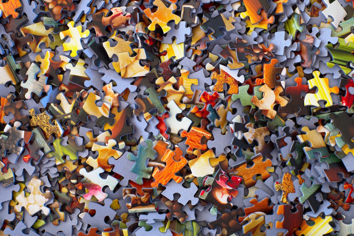 colorful puzzle pieces scrambled together 