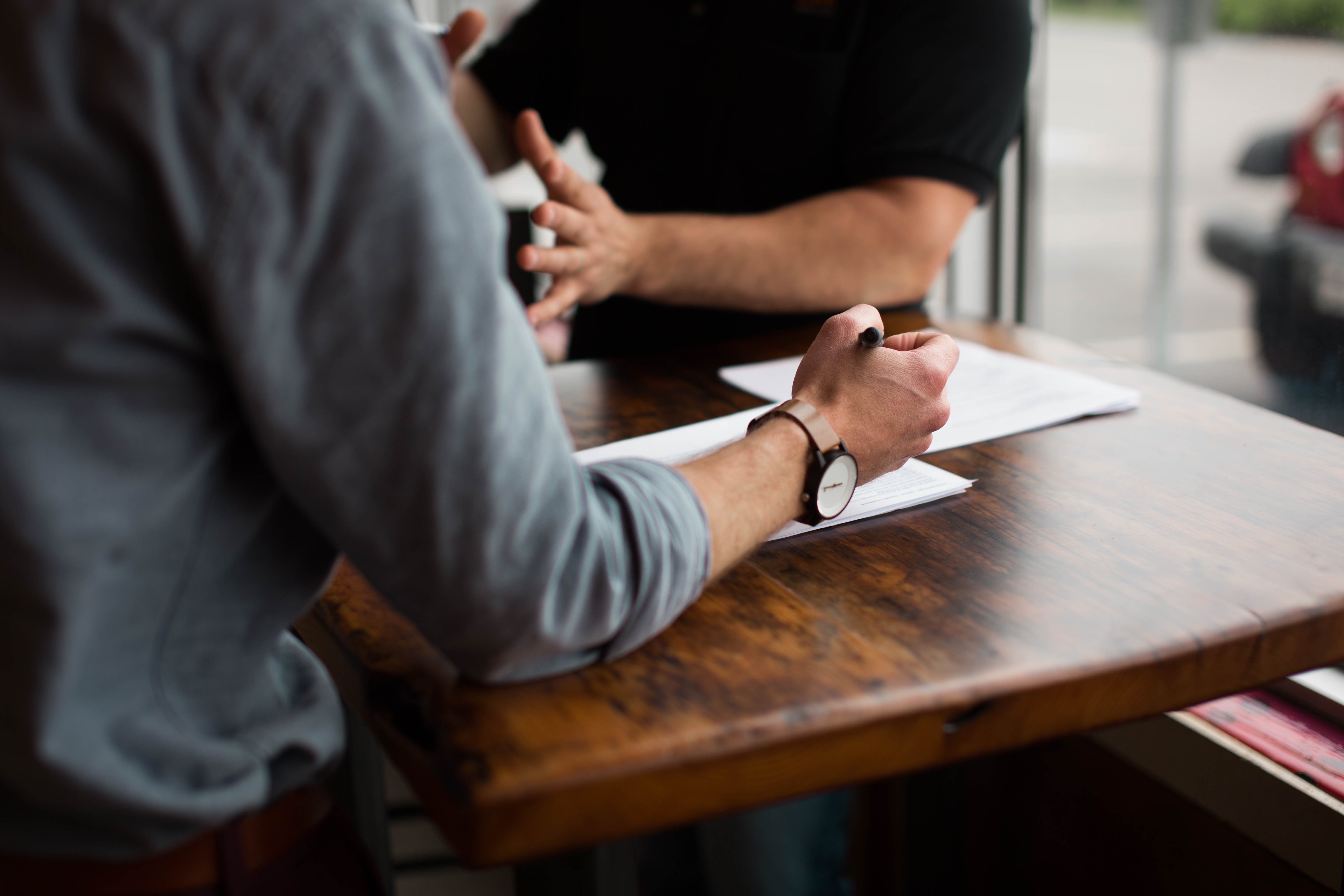 two people chatting on a table 